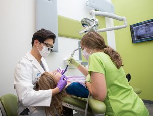 Dr. Lee Performing Dental Procedure